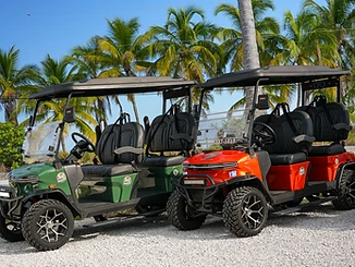 Paradise Rentals staff handing over golf cart keys to a customer