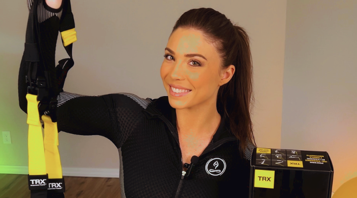 Emma demonstrating TRX suspension training