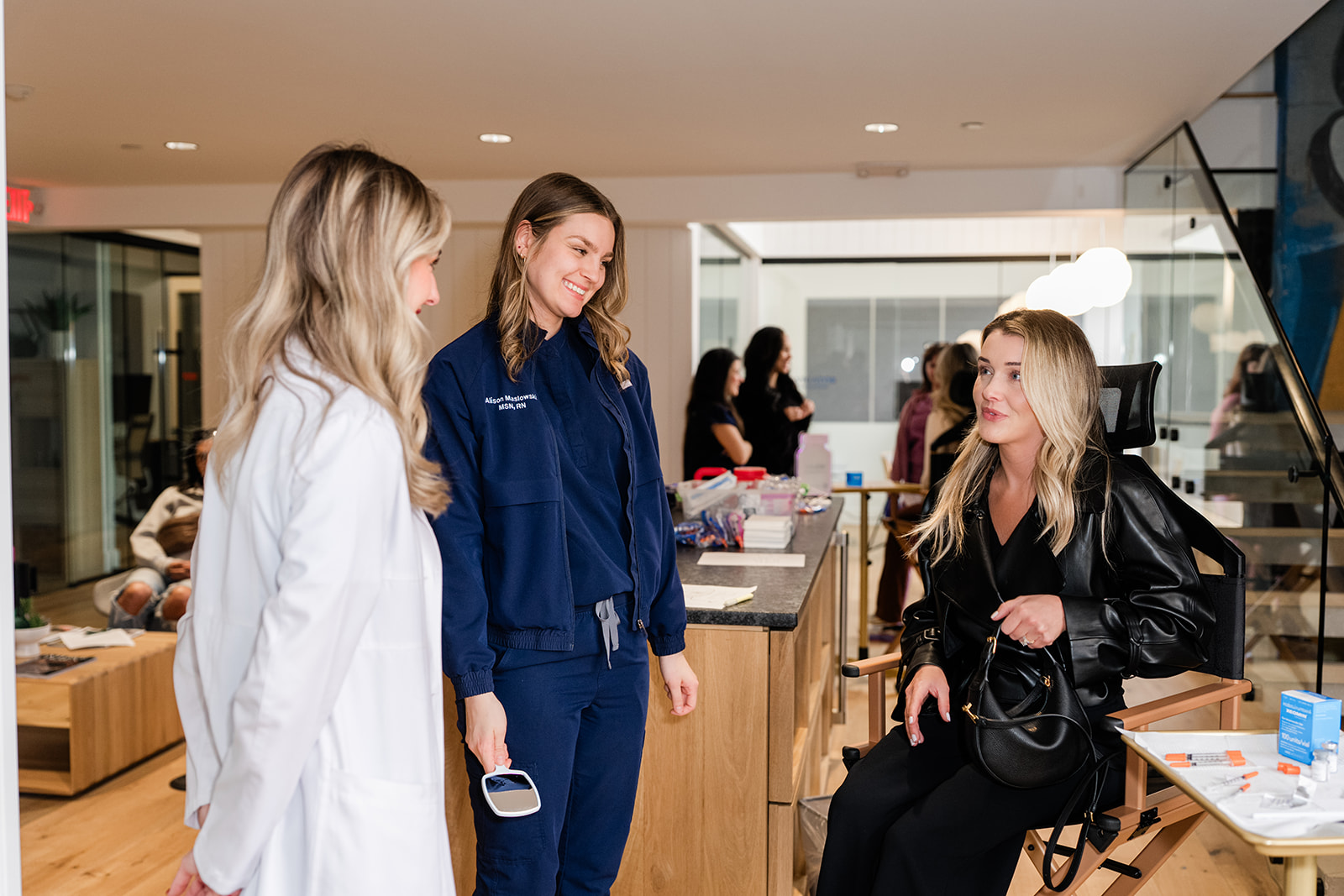 Clinicians reviewing a treatment plan with a patient model during an Academy training day