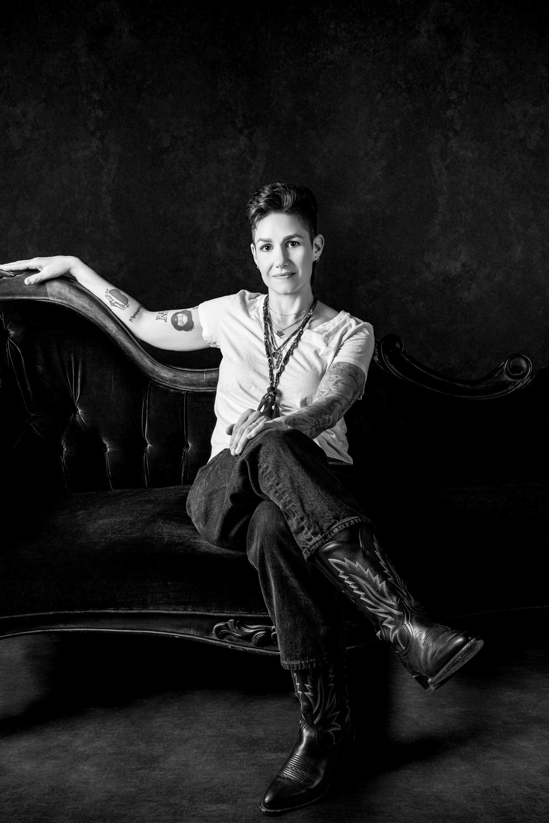 Emily McLoud black and white studio portrait standing, looking down, Jennifer Lindberg photographer