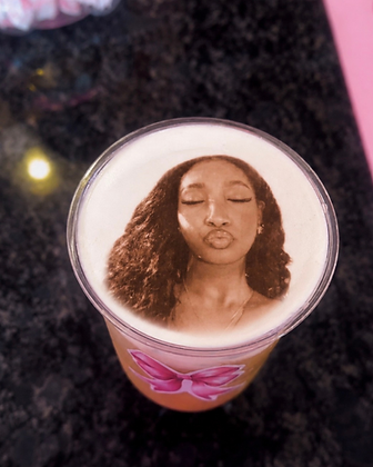A latte with an edible portrait printed onto the foam
