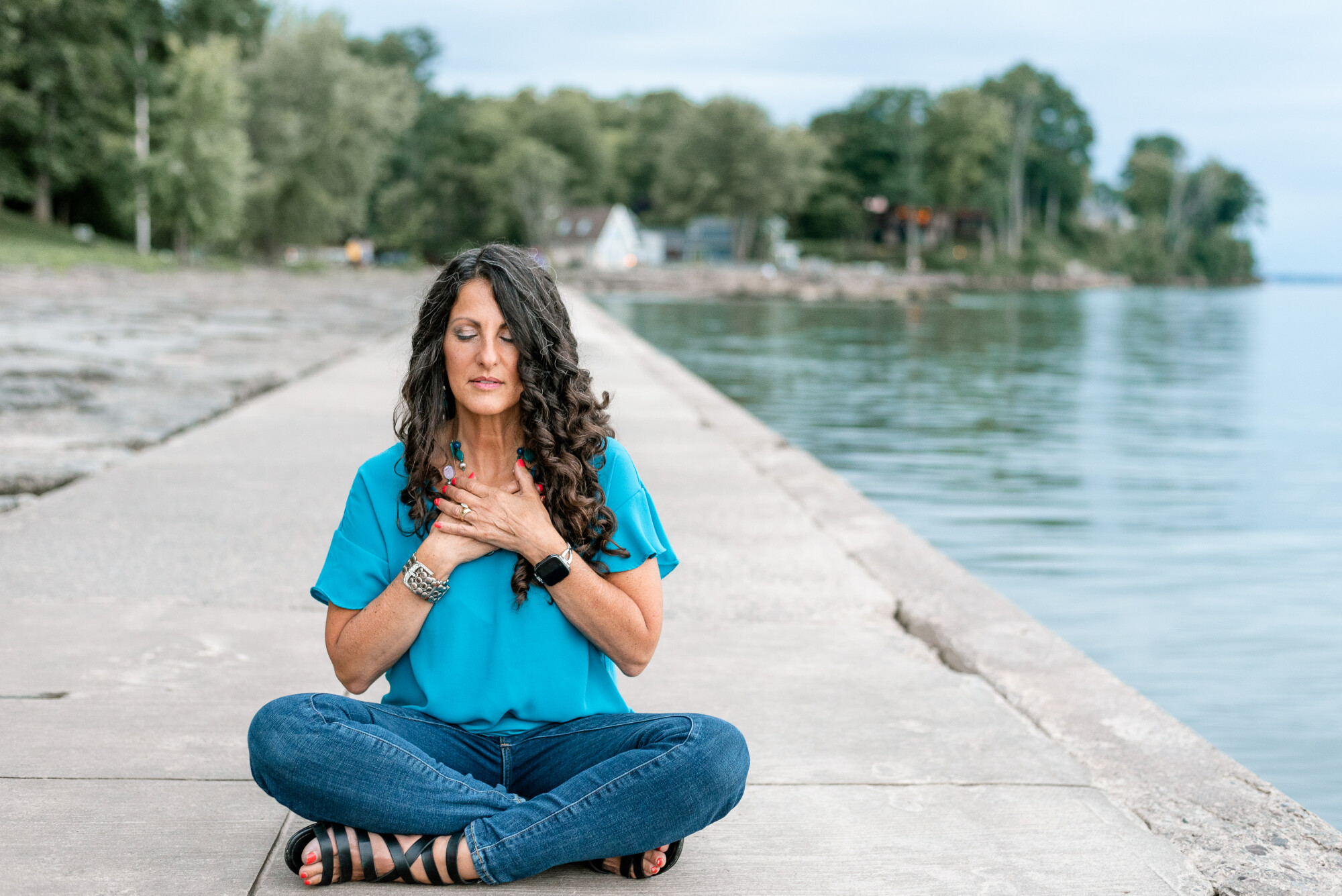 Lisa in meditative stillness by the water
