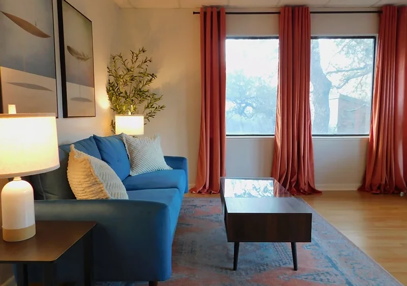 Wide view of the San Antonio therapy office with sofa and natural window light