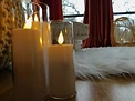 Soft candlelight and floor seating in a quiet corner of a San Antonio therapy office