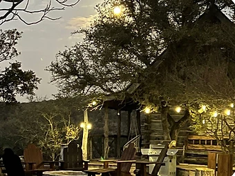 Fire pit and outdoor seating at Camp Milagro retreat property