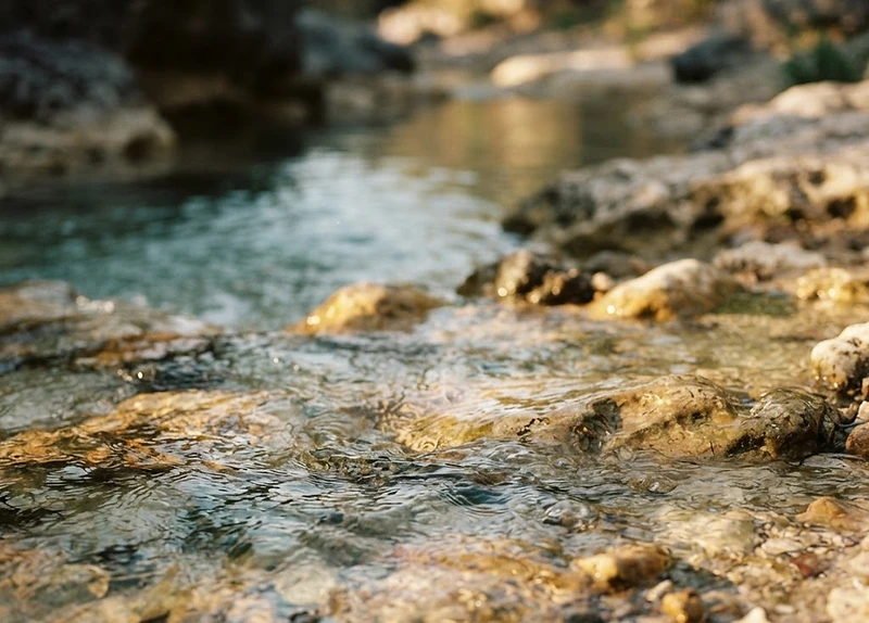 Water moving slowly over weathered stone