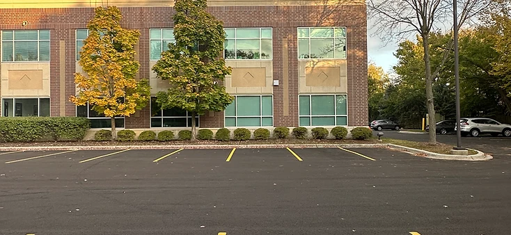 AtomicMedX clinic facade and parking lot