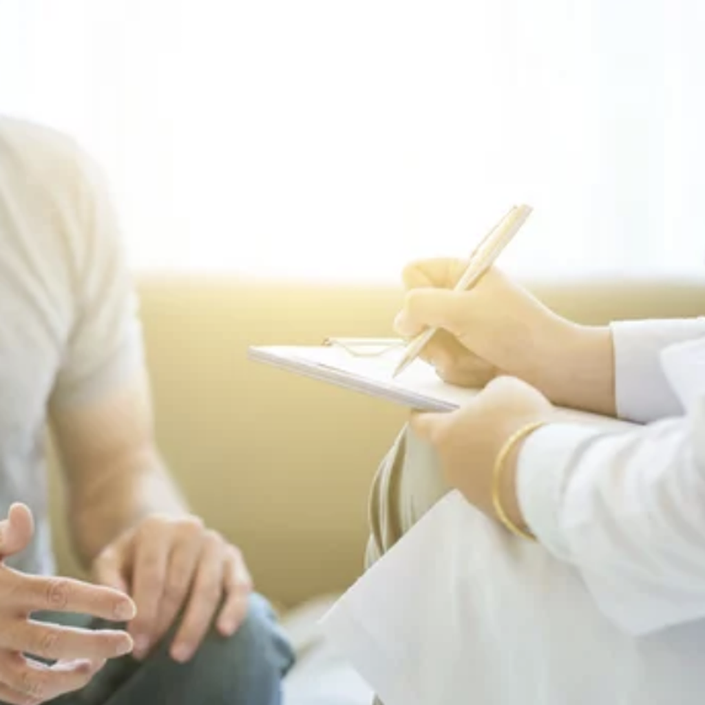 AtomicMedX clinician going over notes with a patient