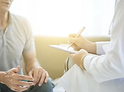 AtomicMedX clinician going over notes with a patient