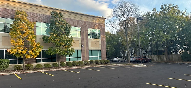 AtomicMedX clinic exterior and parking at sunset