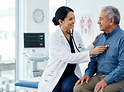 AtomicMedX clinician examining a patient with a stethoscope