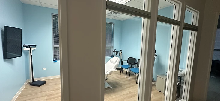AtomicMedX examination room viewed from hallway