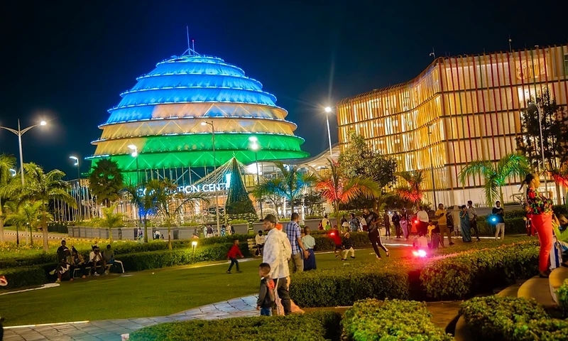 The Kigali Convention Centre illuminated at night with its iconic dome