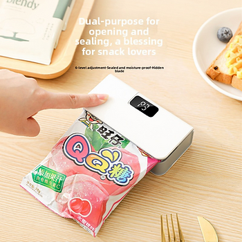 Portable bag sealer sealing a snack bag