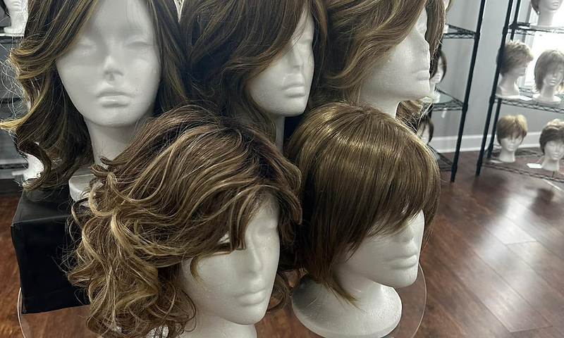 The Wig Chix boutique — wigs displayed on mannequin heads
