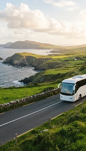 A coach driving along a scenic Donegal coastal road