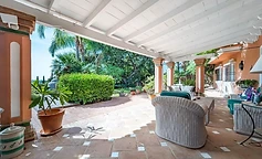 Porch with terracotta pillars overlooking the garden
