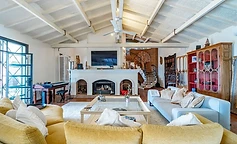 Living room with fireplace and spiral staircase