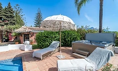 Relax terrace with fringed parasol