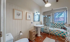 Vintage bathroom with bathtub by the window