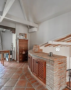 Landing with brick arch and iron staircase