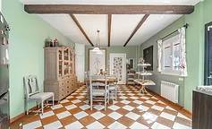 Classic dining room with hutch and floral curtains