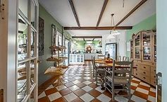 Dining and open kitchen in green tones