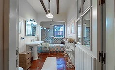 Checkered tiled bathroom with vintage basin