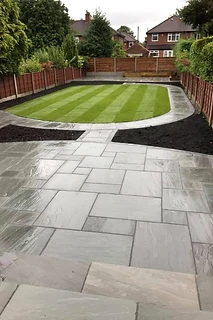 Multi-Level Stone Patio & Striped Lawn