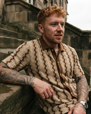 Finn wearing Classic Checkered Short Sleeve Shirt