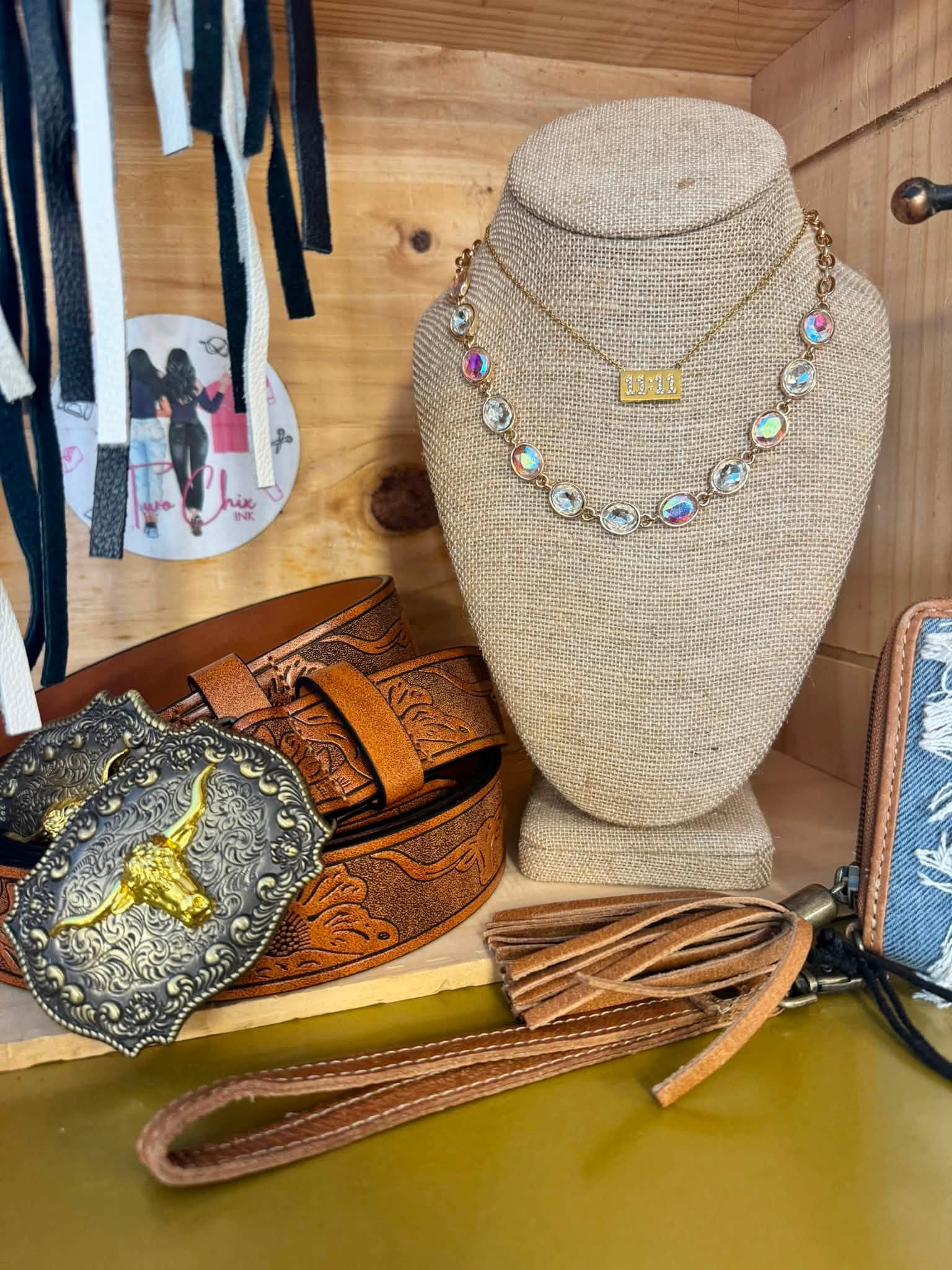 Gold 11:11 necklace and tooled leather belt