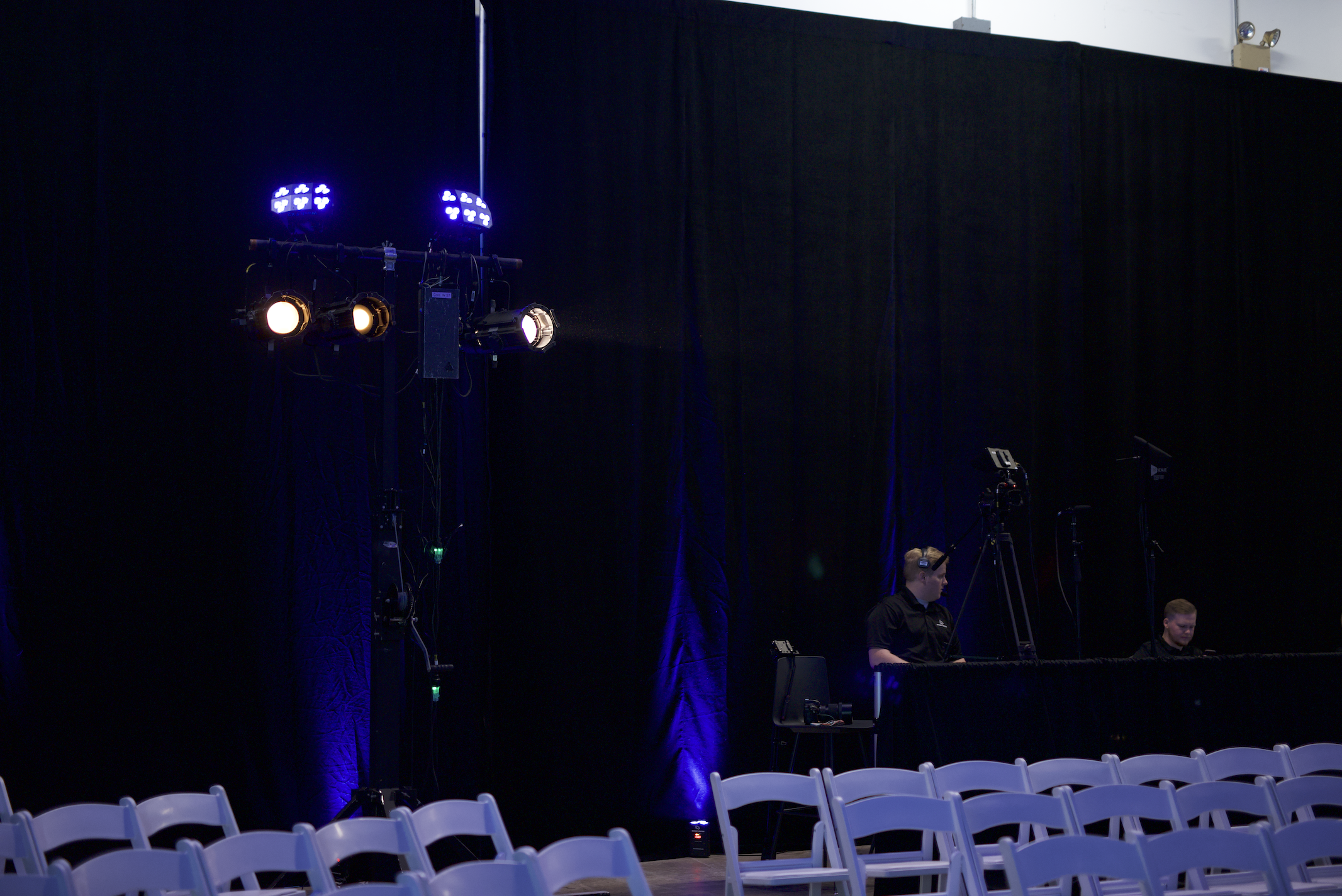 Hurricane Productions team collaborating backstage before a live event