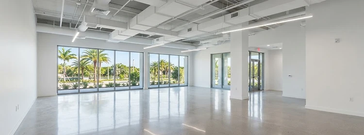 Modern light commercial tenant build-out interior with neat exposed ductwork