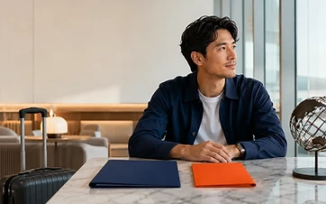 Long-term traveler comparing international health and travel medical insurance folders