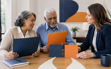 Senior couple comparing Medicare coverage paths with an independent insurance advisor
