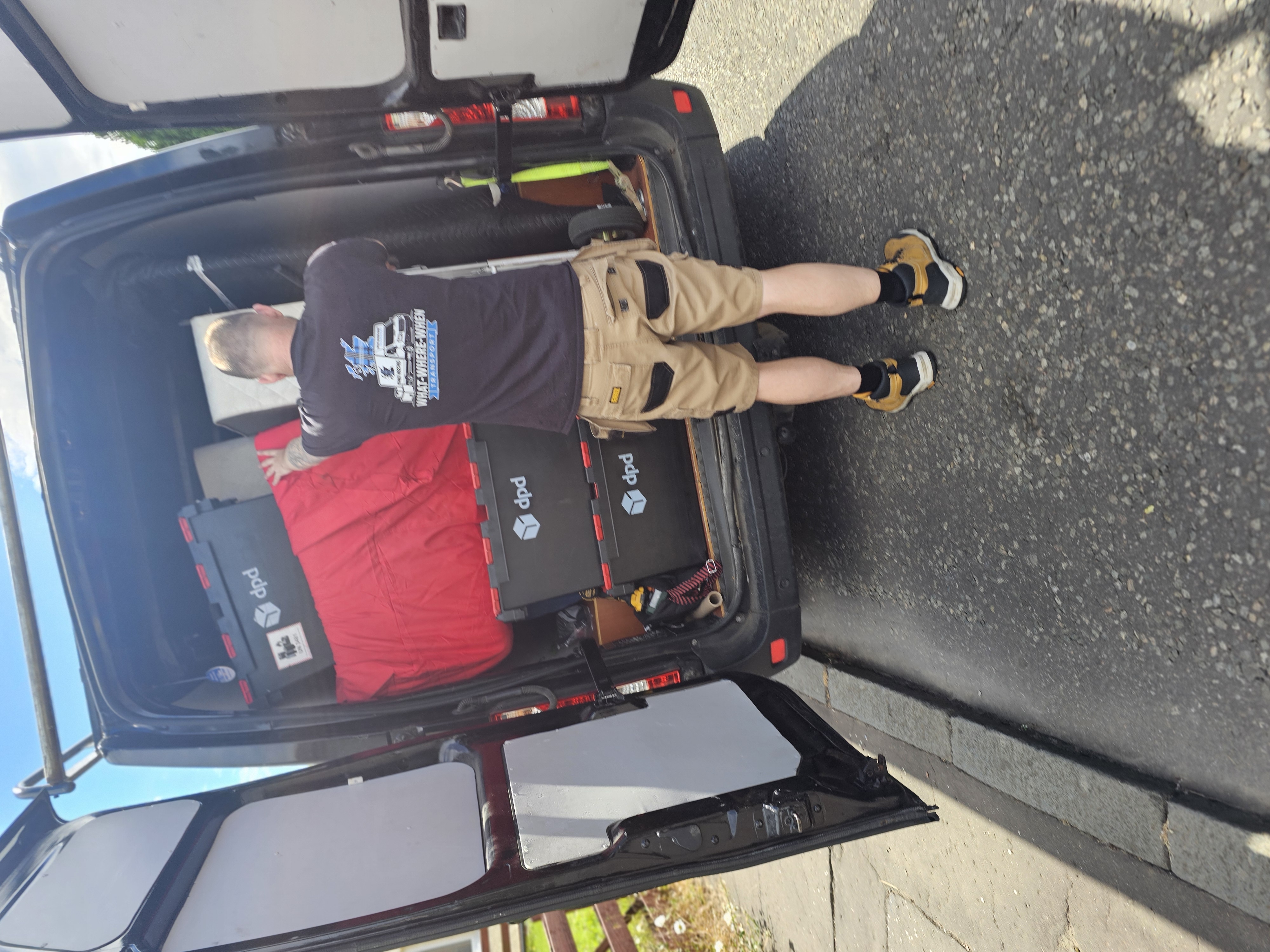 Team member loading van for a national job