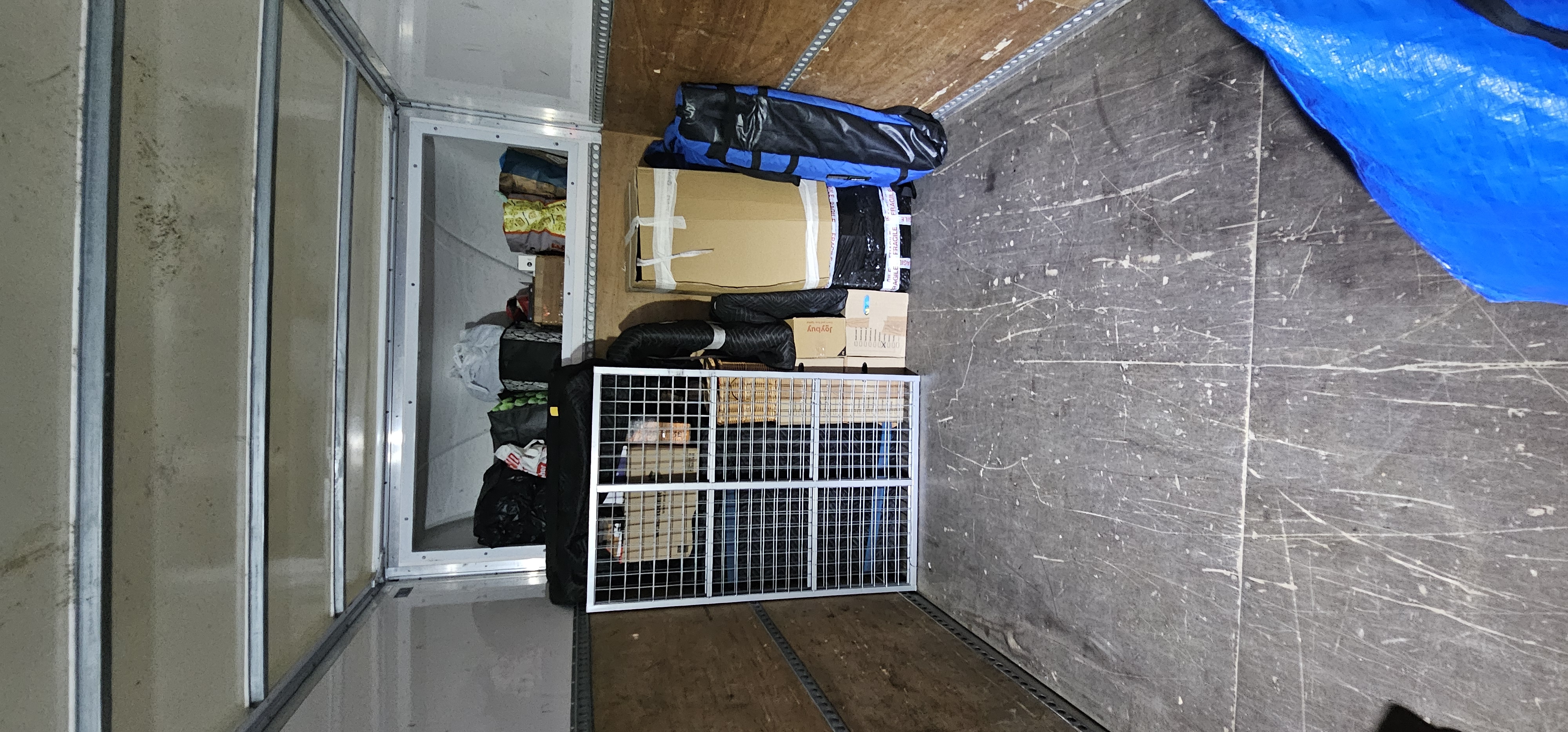 Van interior with items loaded for grouped transport