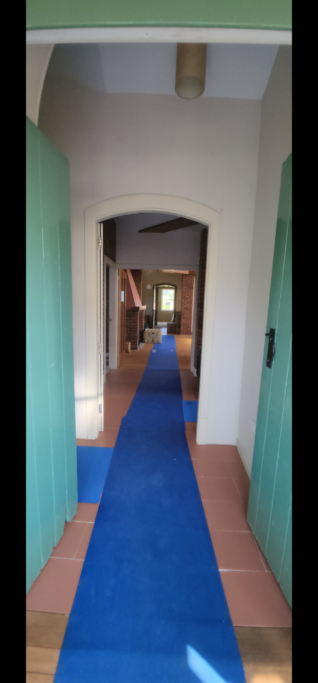 Property hallway protected with floor covering for removal