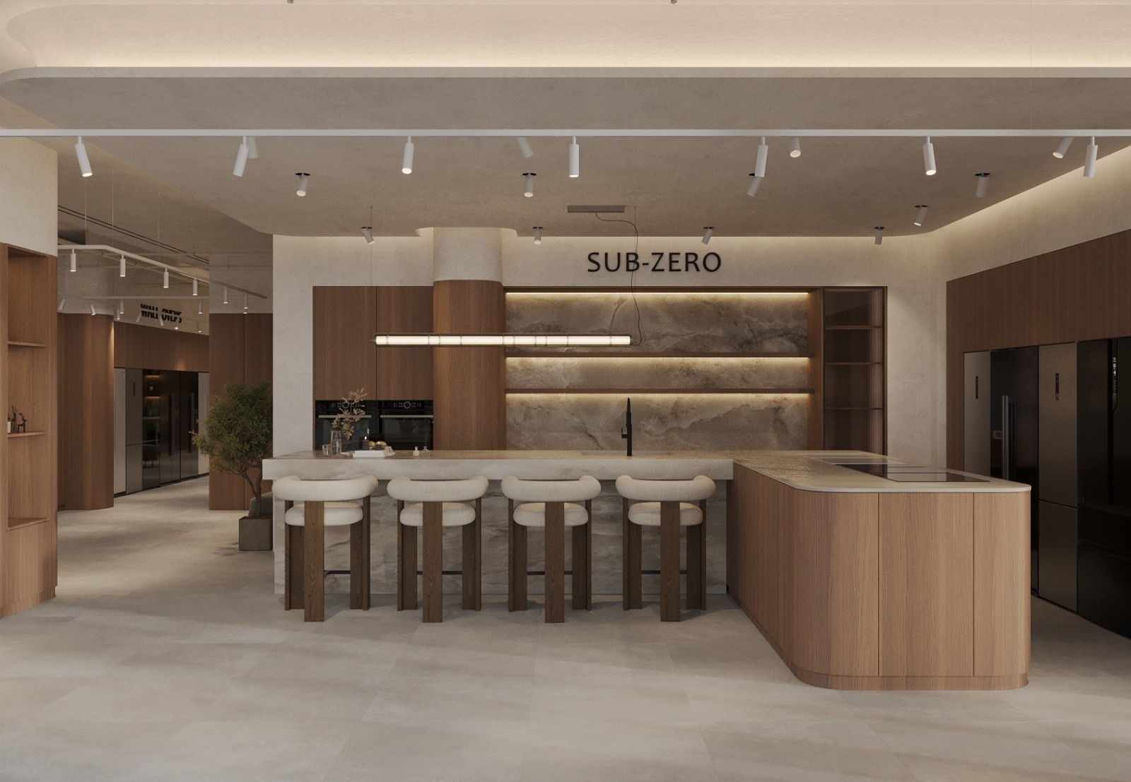 Sub-Zero display kitchen in the showroom with a curved oak island and boucle stools, backlit stone shelving and backsplash, integrated black ovens and refrigeration and track lighting overhead