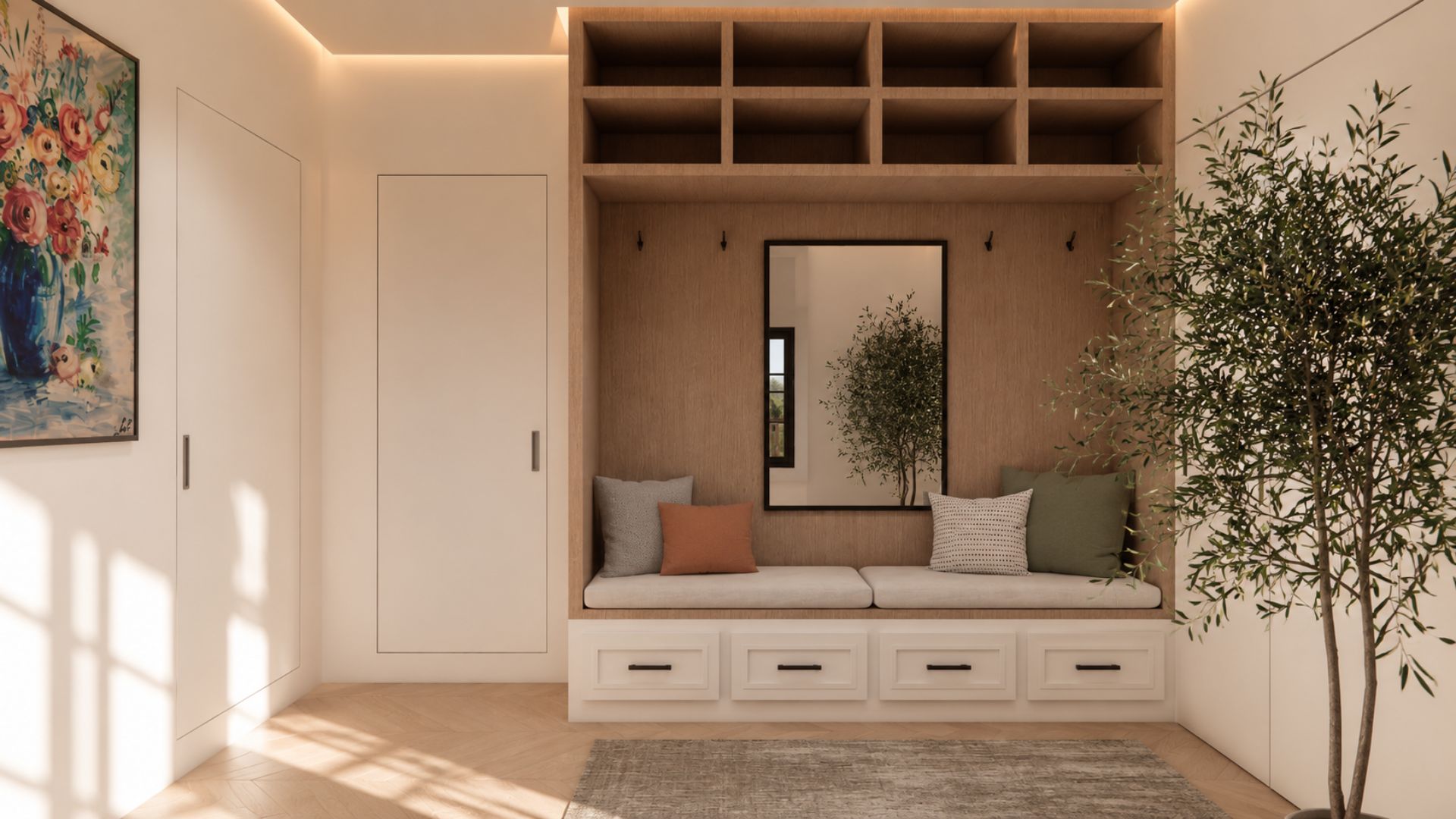 Oak mudroom nook with open cubby shelving, blackened hooks, a black-framed mirror, cushioned bench over white drawer joinery, an olive tree and a floral painting on the plaster wall