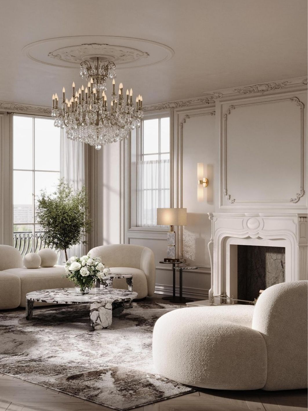 Salon with ornate plaster panelling, a carved white marble fireplace with dark stone hearth, curved ivory boucle seating, a violet-veined marble coffee table and a crystal candle chandelier on a ceiling rose