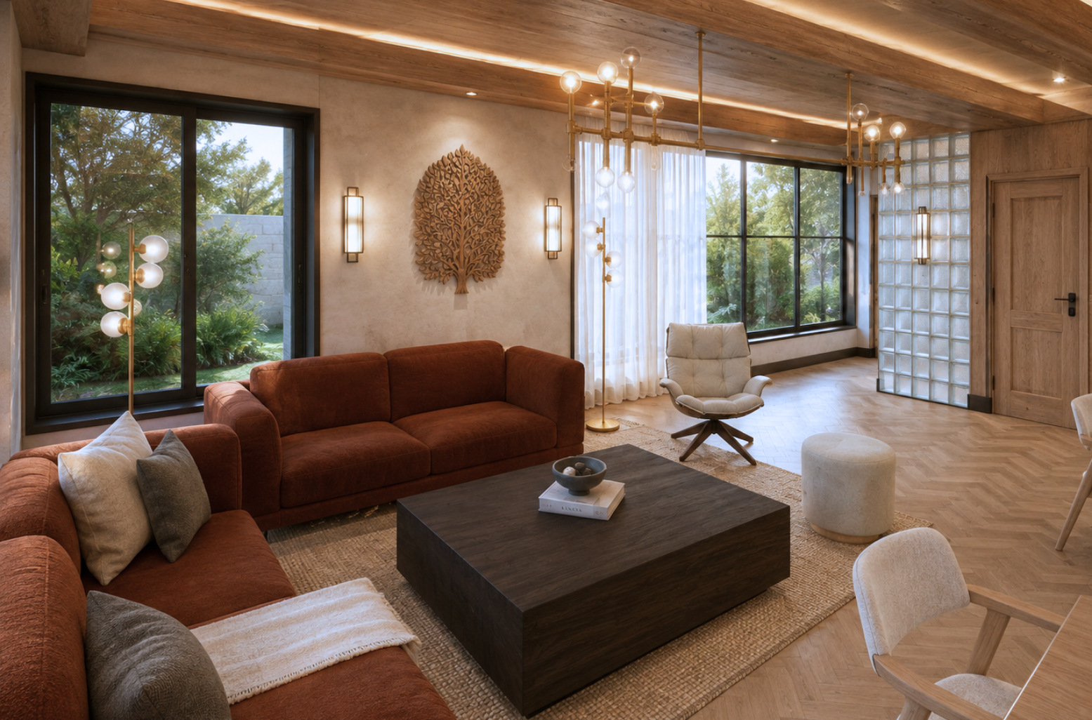 Lounge with a rust sectional and grey cushions, a cream swivel armchair and cylindrical pouf, a dark espresso coffee table holding a Kinfolk book, a laser-cut timber tree-of-life wall sculpture between rectangular sconces, a brass globe chandelier, glass-block partition and full-height forest glazing under a beamed timber ceiling