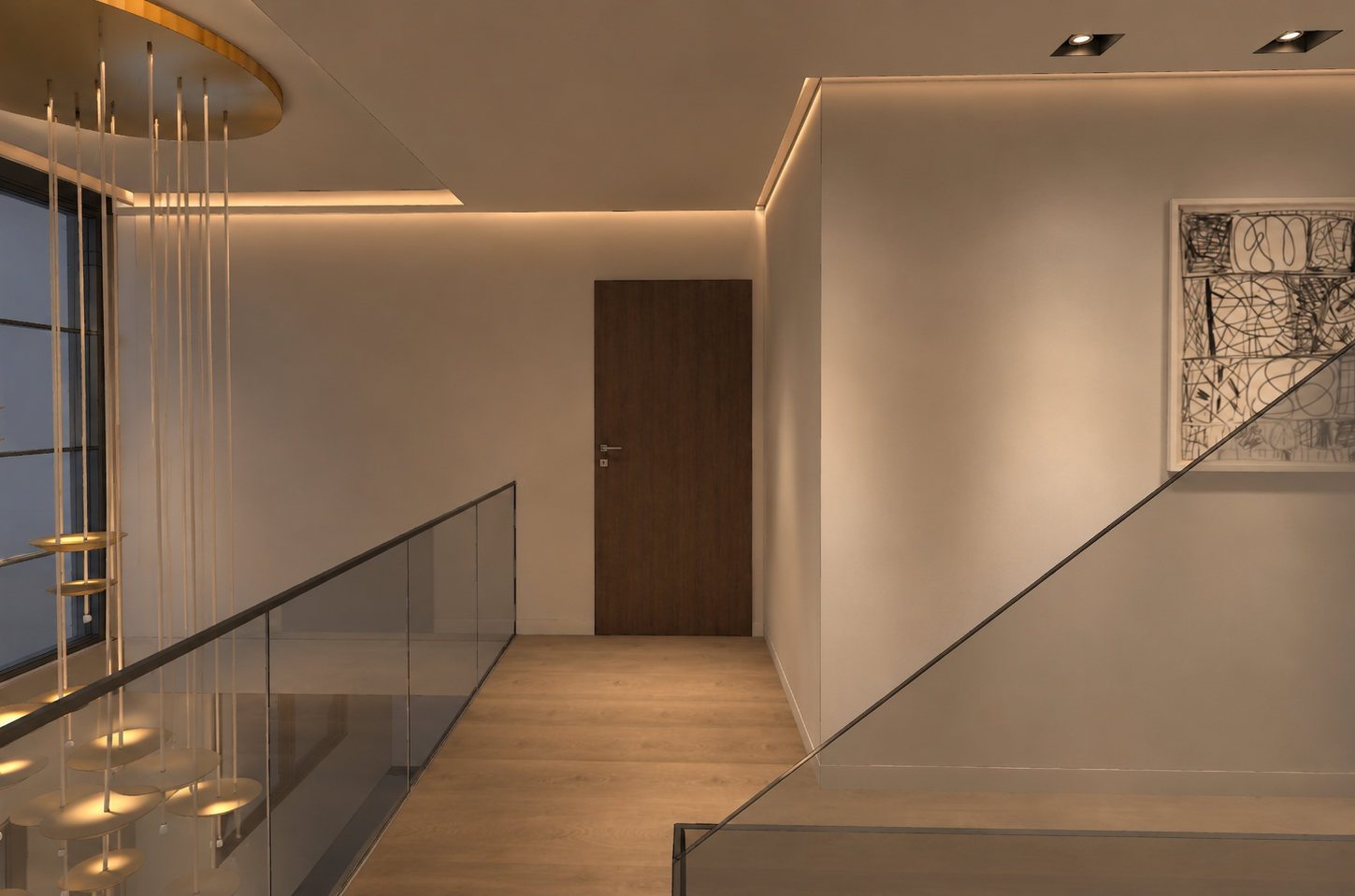 Upper landing with a frameless glass balustrade, cove-lit ceiling, walnut door at the end of the corridor, a framed monochrome drawing and a cascading brass disc chandelier over the stairwell