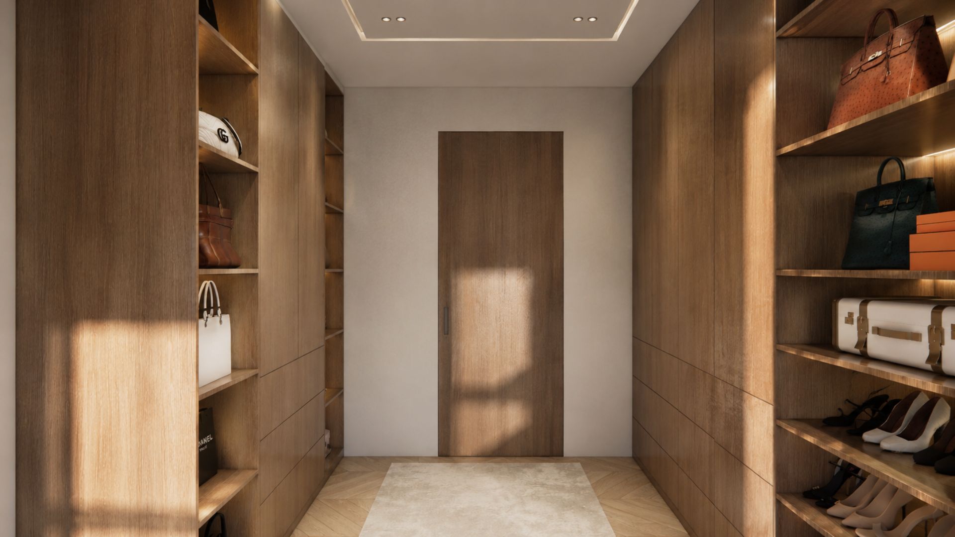 Walk-in wardrobe lined in warm oak joinery with open shelving of bags and shoes, LED-lit shelves, a full-height timber door and a pale rug on herringbone flooring