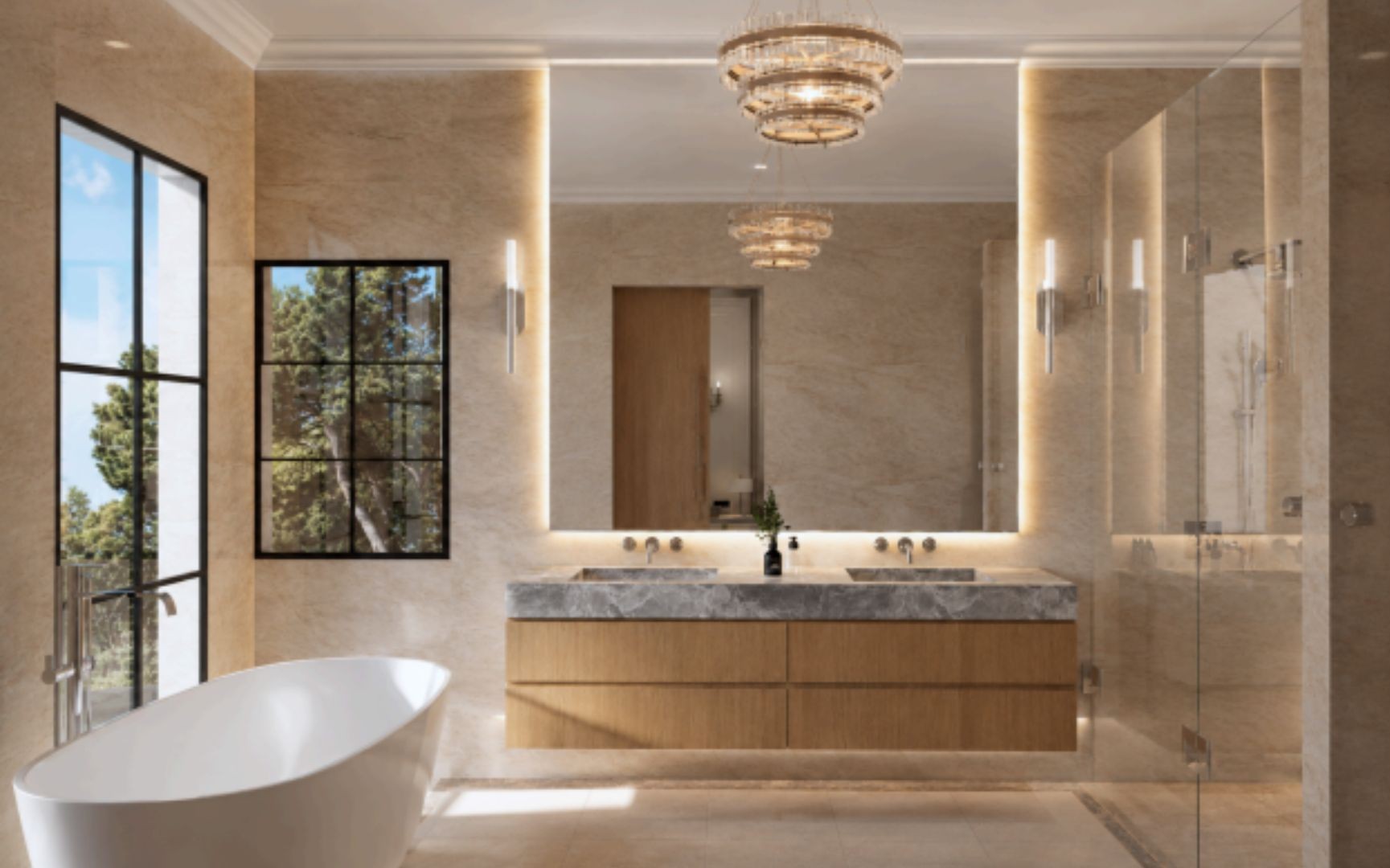 Primary bathroom in warm stone with a floating oak vanity, grey marble top with twin integrated basins, a full-width backlit mirror, chrome wall taps and tiered crystal chandeliers