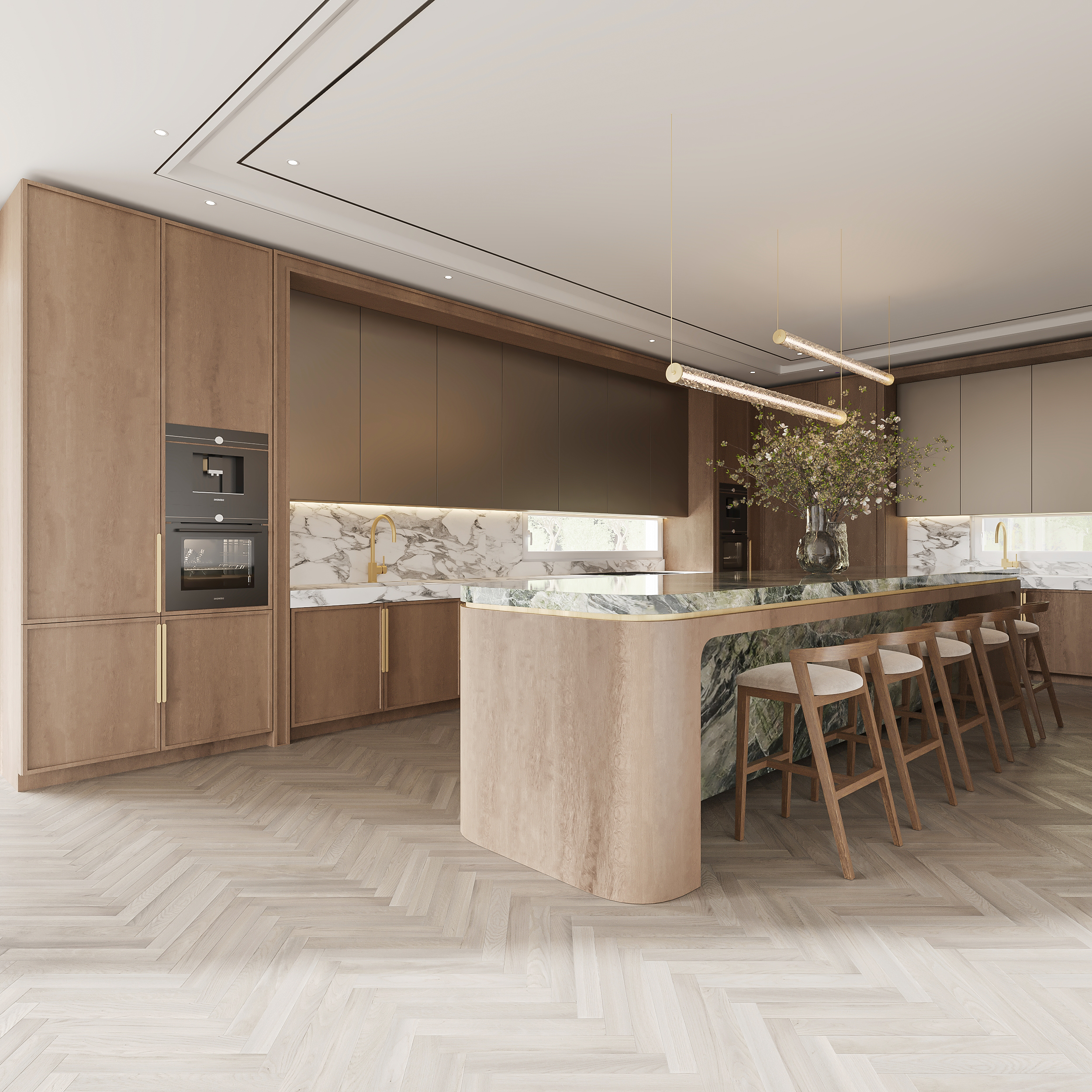 Wide kitchen view with a curved travertine island and green marble breakfast bar, oak bar stools, integrated ovens in full-height oak joinery and marble backsplash under a cove-lit ceiling