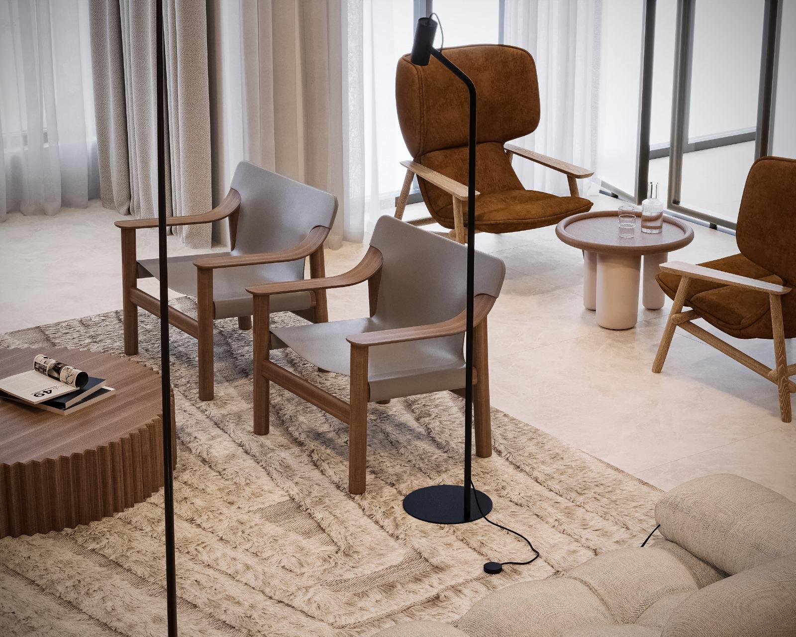 Residents' lounge from above with grey leather and walnut armchairs, tan suede lounge chairs, a fluted timber coffee table, round stone side table and a slim black floor lamp on a deep-pile Berber rug beside sheer-curtained glazing