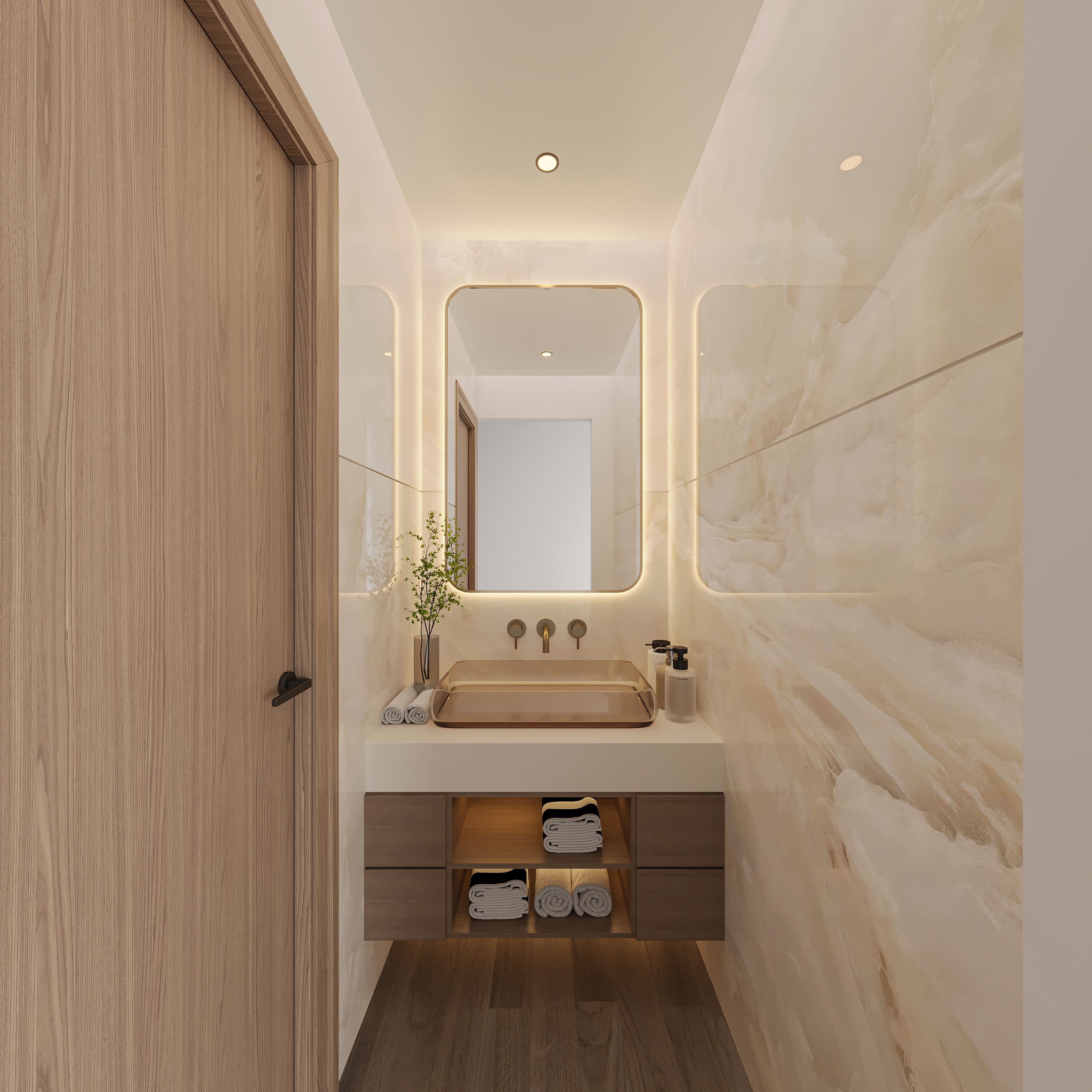 Narrow powder room in pale onyx stone with a backlit brass-framed mirror, bronze wall-mounted taps, a bronze glass vessel basin on a white top and an LED-lit walnut vanity with towels
