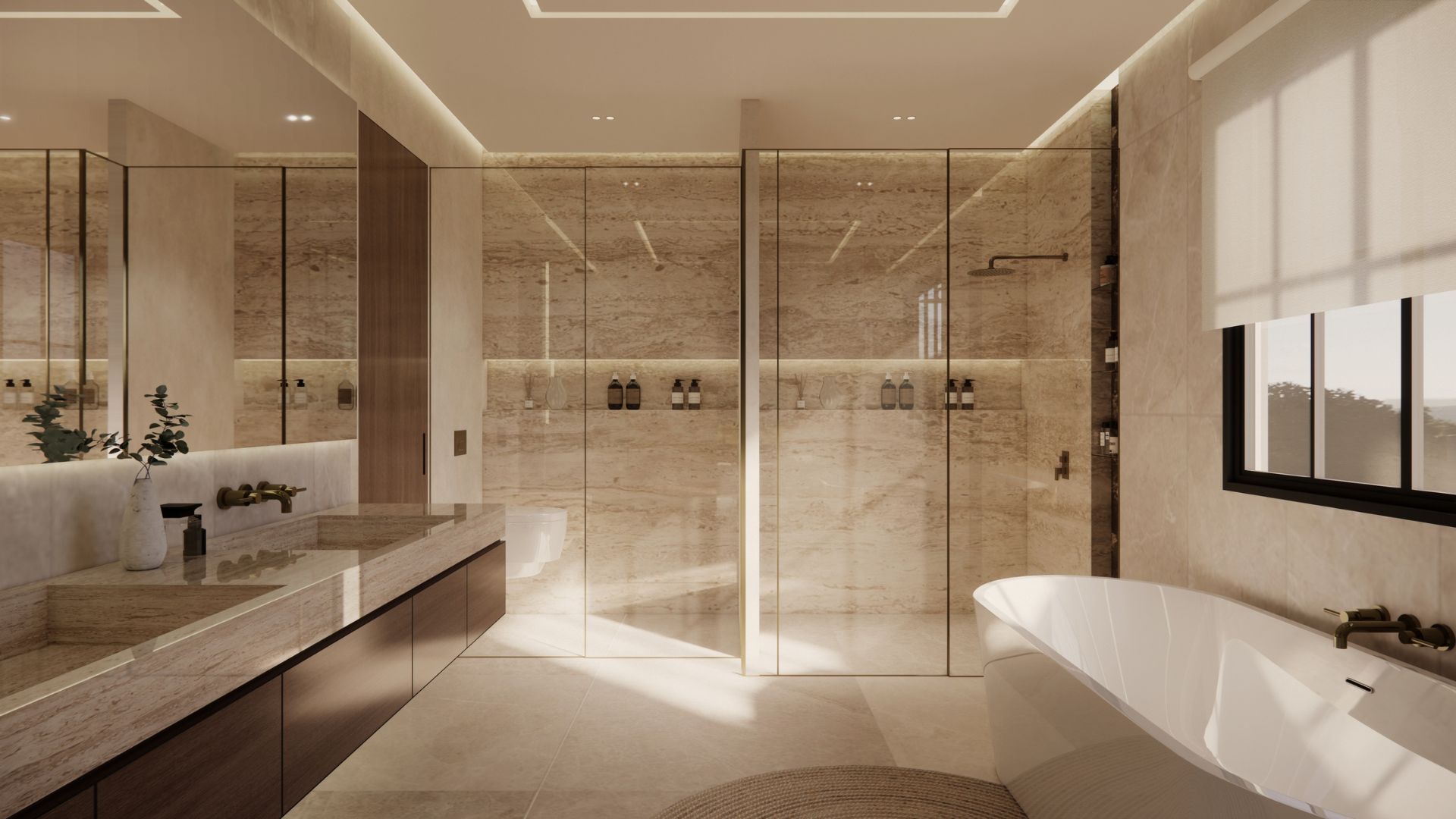 Primary bathroom in travertine with a long stone vanity and twin basins, walnut cabinetry, bronze wall taps, a glass-enclosed walk-in shower and a freestanding oval tub