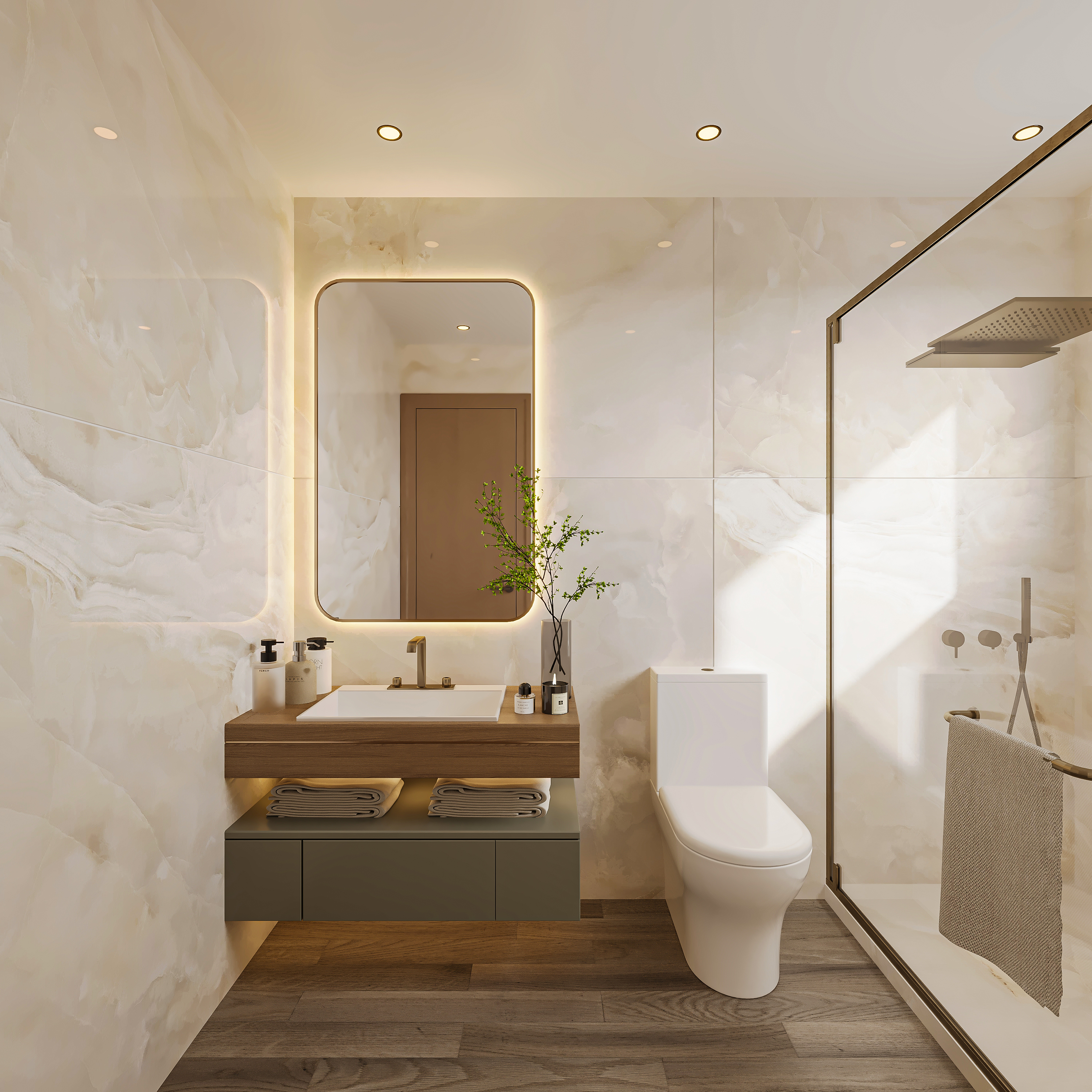 Bathroom in pale onyx-look stone with a backlit brass-framed mirror, walnut-topped vanity on a sage cabinet with folded towels, brass tap and a glass shower enclosure